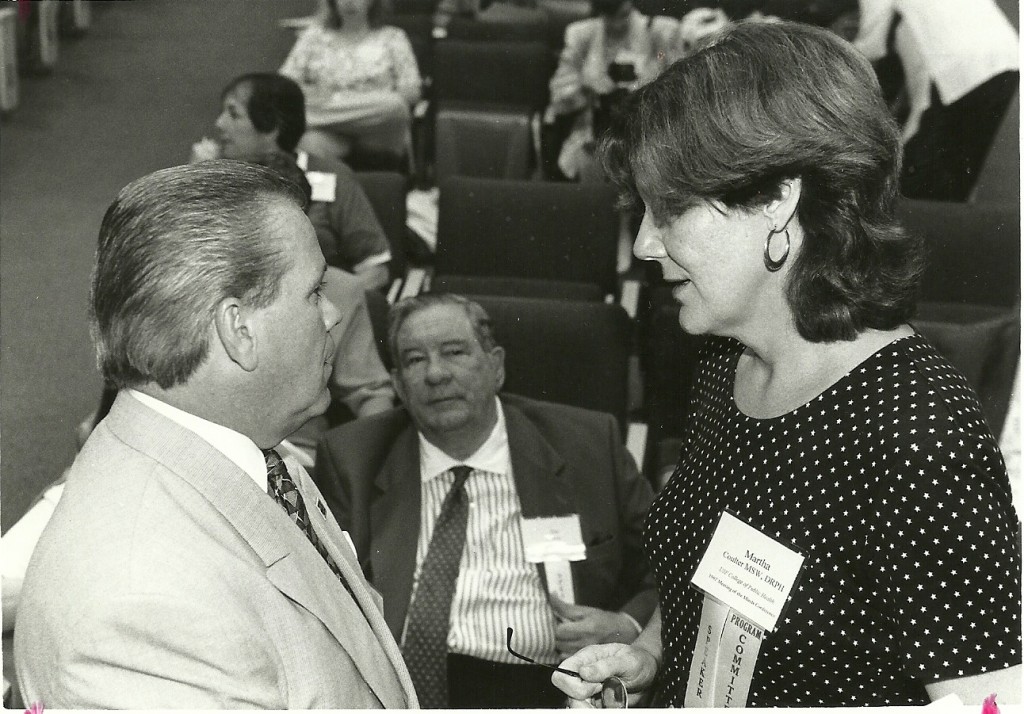 Dr. Coulter chats with Judge Dennis Alvarez (left) and James Harrell at a 1997 function.