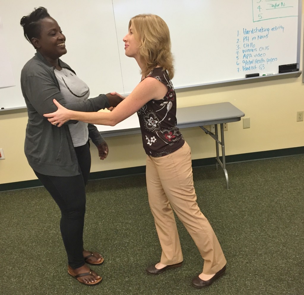 Laura Rusnak gives Guerthie Geffrard the two hand shake.