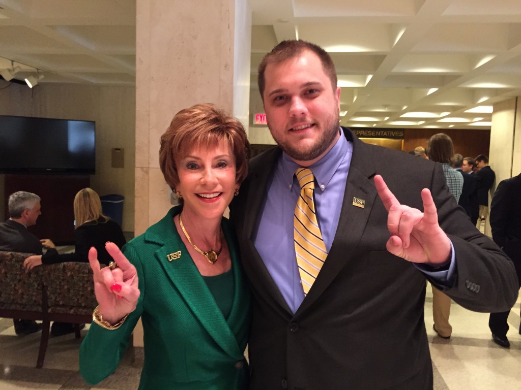 COPH student veteran Joe Close strikes a bullish pose with USF System President Dr. Judy Genshaft. They participated in the 2015 USF Day in Tallahassee, Fla.