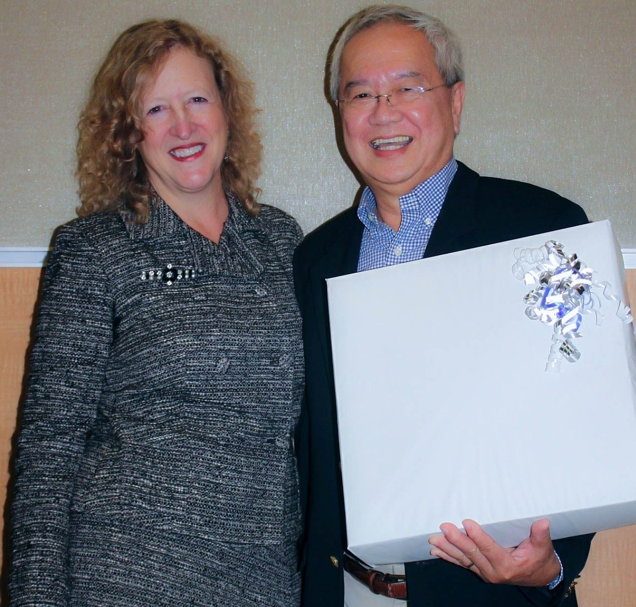 Dean Donna Petersen with Dr. Boo Kwa celebrating his 30 years of service at the College of Public Health. (Photo by Ellen Kent)