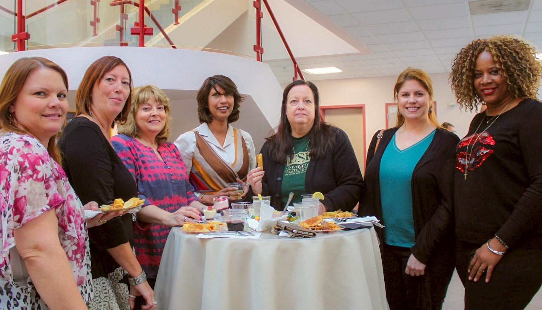 COPH staff enjoying the Length of Service reception. (Photo by Ellen Kent)