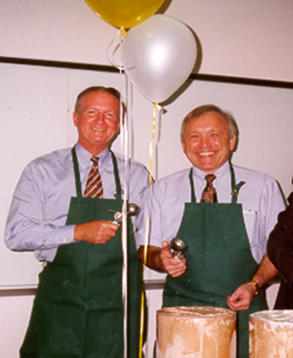 Dr. Charles Mahan and Dr. Phillip Marty serving at a COPH ice cream social (Photo courtesy of Marty).