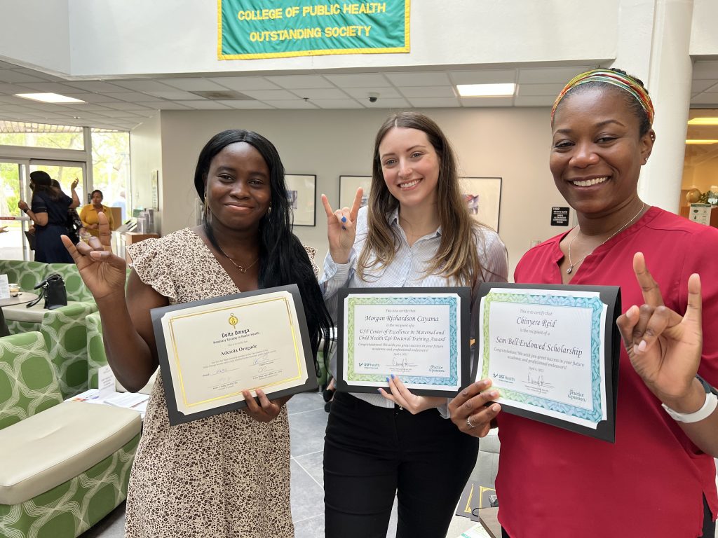 COPH students Adesola Orogade, Morgan Cayama and Chinyere Reid with their awards at the NPHW Awards Ceremony. (Photo by Anna Mayor)