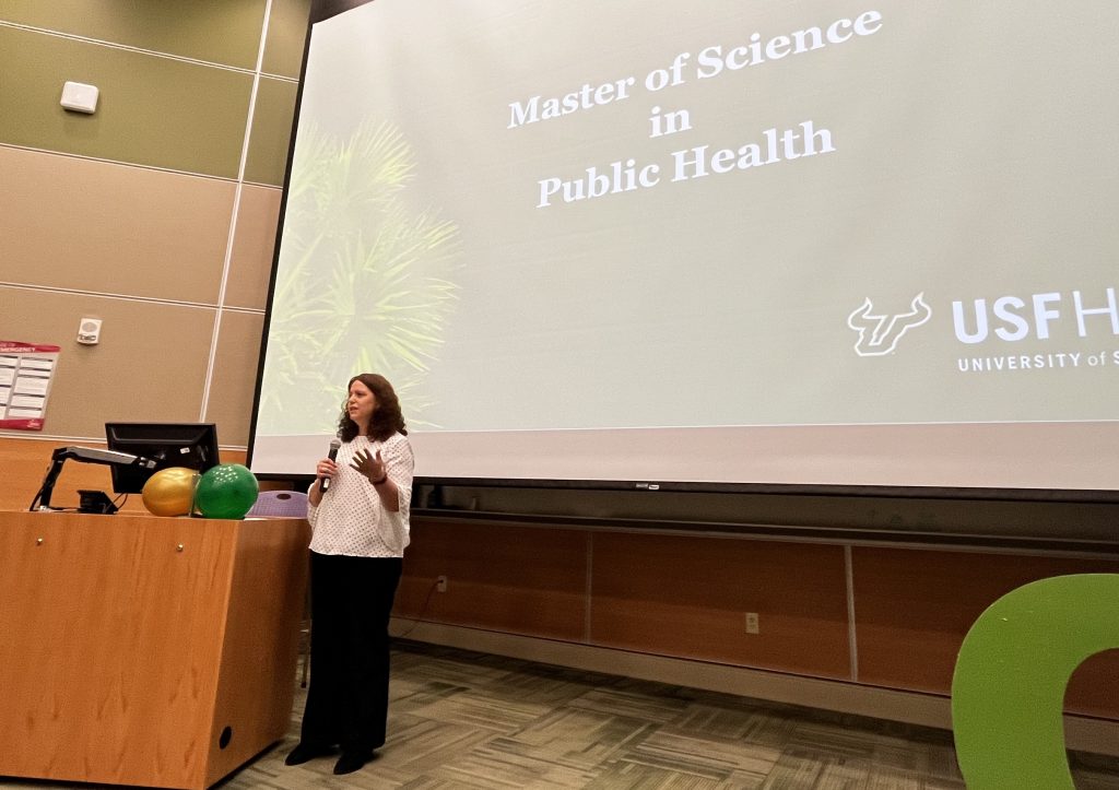 Dr. Jaime Corvin speaking at the graduate ceremony. (Photo by Caitlin Keough)