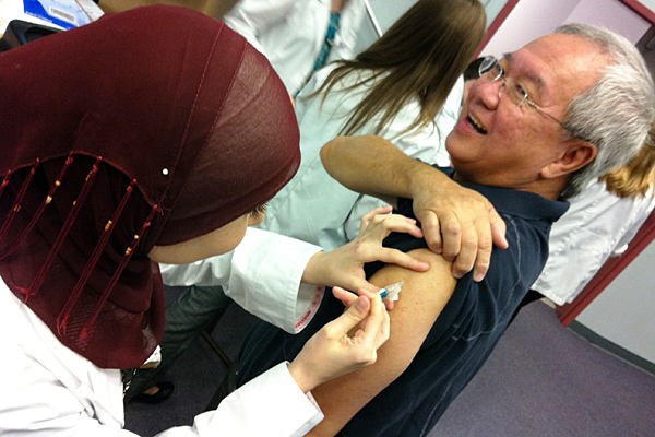 Boo Kwa, USF Health International Programs, flu shot drive 2012, USF College of Public Health