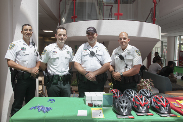 Hillsborough County Motorcycle Unit Deputies Steve Gutierrez, David Thatcher, Dominick DeSiato and Timothy Berg gave away bike safety helmets, lights, vests, reflective wrist bands and whistles.